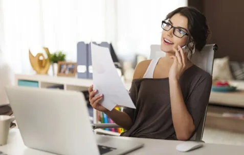 woman sitting thinking at home office
