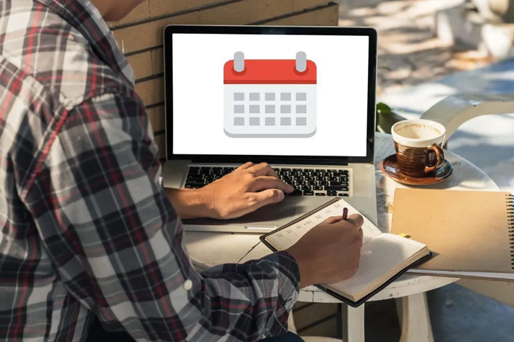 man looking at calendar on screen